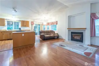 Inside the front door you walk into a welcoming open concept living room /kitchen area. Complete with a propane gas fireplace.