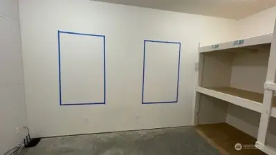 Egress windows framed behind sheet rock. Remove that and the exterior siding and install 2 windows easily!