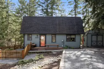 Stunning cottage in a scenic backdrop with  lush trees and water views