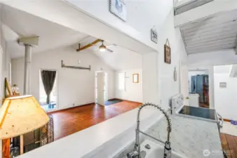 Kitchen opening to living room pass through