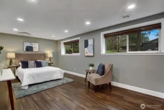 Expansive downstairs bedroom with engineered bamboo flooring installed in 2020.