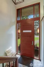 Stunning 8-foot door with transom & sidelight windows for maximum light.