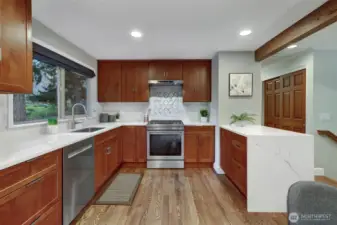 Lovely quartz countertops & tile back splash, too!