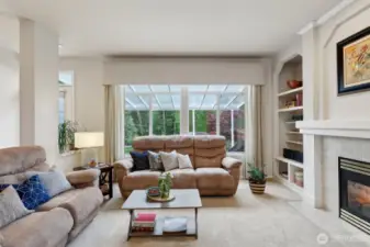 Family Room showing off its gas fireplace and sliding door to back yard