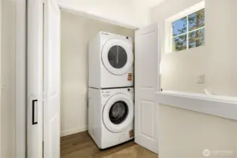 Washer & dryer set up off of upstairs landing.