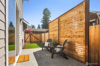 Outdoor patio with fence adding additional privacy.