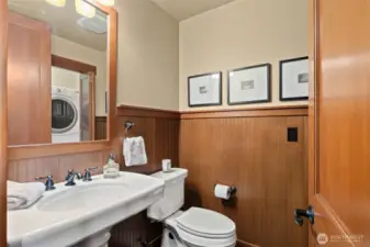 Functional downstairs guest bathroom and laundry.