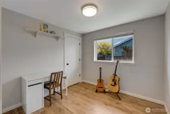 Second bedroom with views onto the side yard.
