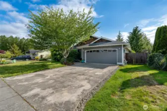 Mature landscaping graces the lovely front and back yards.