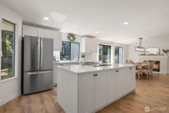 Renovated kitchen with Stainless Steel appliances, Quartz Countertops, and Hardwood floors