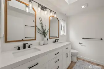Tastefully updated Primary Ensuite with dual sinks and frameless glass shower.