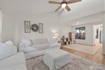 Living room leading to the dining room (currently a play area or extra flex space)