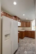 Refrigerator stays - new stove coming soon