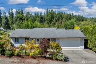 Front of house with additional parking