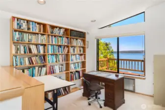 Upper-level library boasts a large window with breathtaking views of Hood Canal and the Olympic Mountains—an inspiring space to read, work, or relax.