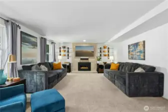 Expansive family room connecting wet bar and kitchen