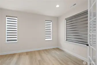 This multi-functional room could be used as an office or den.