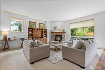 Flooded with natural light, the living room offers stunning greenbelt views.