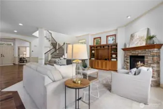 Cozy up by the gas fireplace with custom mantle and surrounding built-ins.