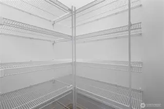 Walk-in pantry adds function and storage to this well-designed kitchen.