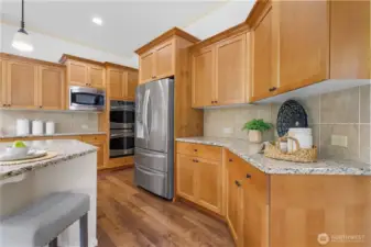 Sleek granite countertops and abundant cabinetry for all your cooking needs.
