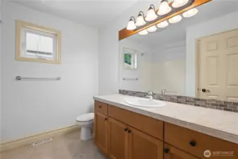 Full bath with tub/shower combo.
