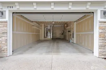 Expansive 3-car tandem garage with plenty of space for cars and gear.