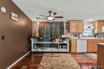Sliding glass door behind the curtain opens to backyard