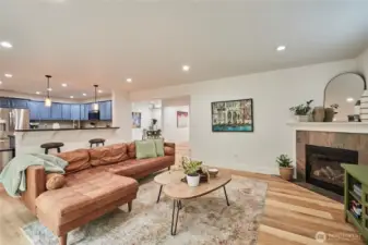 A look back towards the kitchen, formal dining room and front entrance from the corner of the living room.