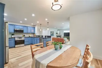 A look at the kitchen and living room from the informal dining area.