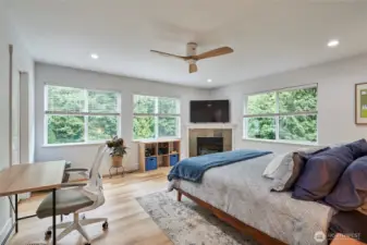 The primary bedroom is very spacious with hard surface flooring and ample closet space. It also has a gas fireplace for cozy winter evenings.