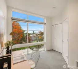 Bedroom 2 on second floor that also works great as a home office with the abundant natural light and gorgeous foliage.