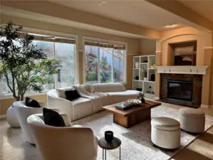 Soft light, warm tones, and garden views create a living room that feels instantly welcoming. Every corner is thoughtfully styled, offering the perfect setting to unwind, entertain, and enjoy home.