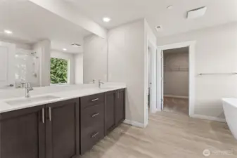 Double sink in the primary bath with quartz countertops. Primary bedroom big enough for a king or cali king bed. Pictures are for representational purposes only, colors and features may vary.