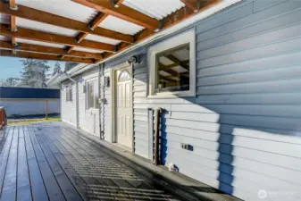 Covered deck area, right off the kitchen, which is a great place for the BBQ