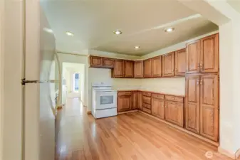 Kitchen with a plethora of oak cabinetry