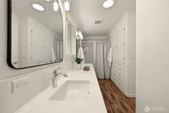 Second bath with double sinks and lots of storage for all your linens!