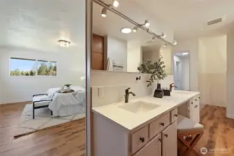 Primary bath has been updated with hard surfaced counters, double sinks, seperate shower and soaking tub, plus tons of built ins!