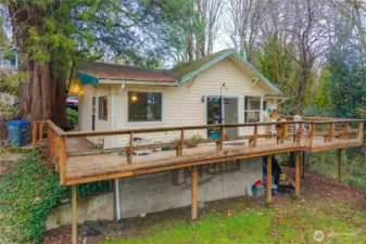 Large wrap-around deck, living room, and dining room have the best views from the home. Two bedrooms and one full bathroom on the main floor, plus it's plumbed for 2nd bath on lower level.