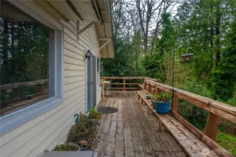 Showing the other half of the wrap-around deck w/ built-in seating. Ready for your summer BBQing!