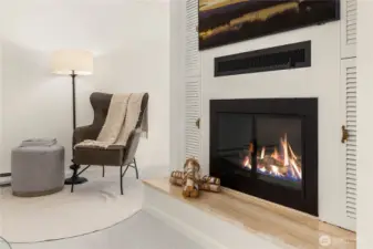Cozy wood fireplace in the main living area.