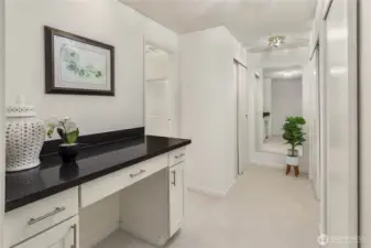 Vanity and closets in primary bedroom suite.