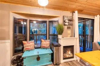 Living room with electric fireplace and sliding door access