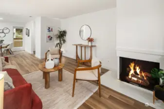 Living room with wood-burning fireplace.