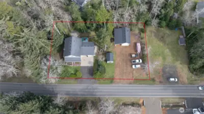 Property sits on not one, but two, secluded wooded parcels on the desirable east side of Ocean Shores.