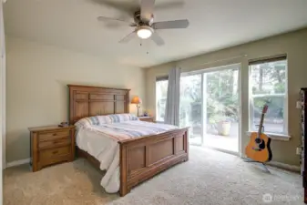 Beautiful main floor primary suite opens onto the rear deck.