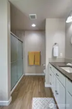 Lovely step in shower is featured in the primary bath.