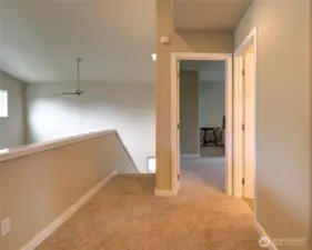 At the landing at the top of the stairs, there is another bedroom and bathroom.