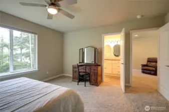 The upstairs bathroom is accessed from both the bedroom and the hallway.
