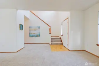 You’ll love coming home to the dramatic entry, featuring a freshly painted blue front door that makes a bold first impression. Inside, rich, wide-plank hardwood flooring offers both easy care and timeless beauty, setting the tone for a welcoming, elegant atmosphere. This inviting entryway creates a memorable first moment and sets the stage for comfortable living and effortless entertaining.